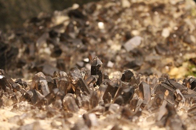 Close up image of a brown and spiky smoky quartz crystal