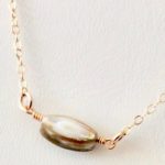 shell and gold necklaces by chelsea bond