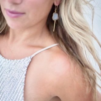 hair blowing with earrings in the wind
