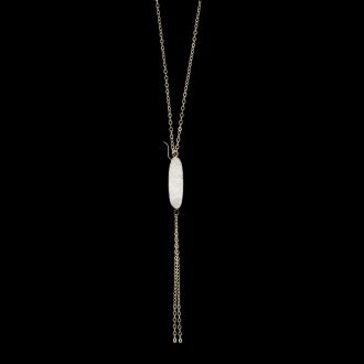 Gold lariat drop necklace with an oval white gemstone pendant against a black background.
