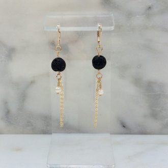 Handcrafted aromatherapy drop earrings featuring porous black lava beads, tiny white freshwater pearls, and shiny 14K gold-filled wire.