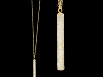 white stone necklace on gold chain