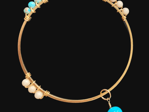Gemstone bangle bracelet with charm.