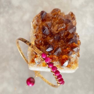 Pink gemstone bangle with citrine gemstone.