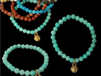 Gemstone bracelet with tibetan bell charm