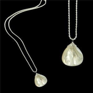 Sterling silver necklace with shell pendant.