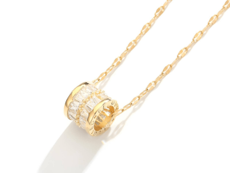 Gold waterproof necklace featuring a sparkling crystal pendant.