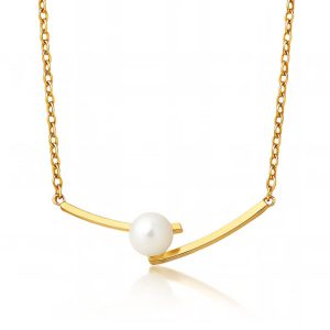 Minimalist gold curved bar necklace with a central white pearl on a reflective white background
