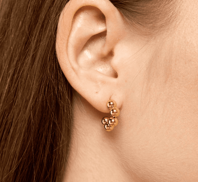 Gold Bubble Stud Earrings - Small, Waterproof, Tarnish-Resistant, Hypoallergenic A pair of small, gold bubble-shaped stud earrings with a smooth, polished finish.