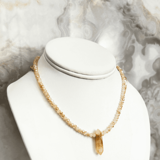 tulum crystal point neckalce 3-min Short crystal point necklace on white bust.