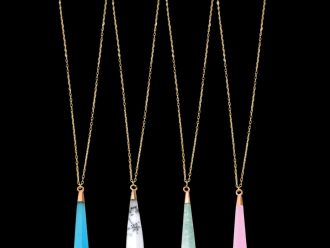 Gemstone teardrop pendant necklaces in sky blue chalcedony, dendritic opal, amazonite, and rose chalcedony, set on delicate gold chains.