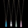 Gemstone teardrop pendant necklaces in sky blue chalcedony, dendritic opal, amazonite, and rose chalcedony, set on delicate gold chains.