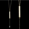 White Druzy Bar Lariat Necklace – Elegant Gold Chain with Crystal Drop White druzy bar lariat necklace with gold chain and crystal drop, featuring a shimmering natural gemstone.