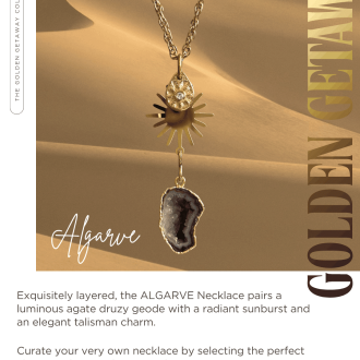 Product showcase image for the Algarve Necklace from the Golden Getaway Collection, featuring a gold link chain layered with a crystal sun drop charm, a multi-ray sunburst medallion, and a dark gold-rimmed agate druzy geode slice pendant on a warm sandy background with wholesale ordering text below.