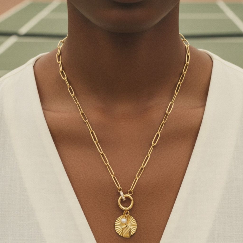Gold pickleball and padel necklace with caribiner clasp.