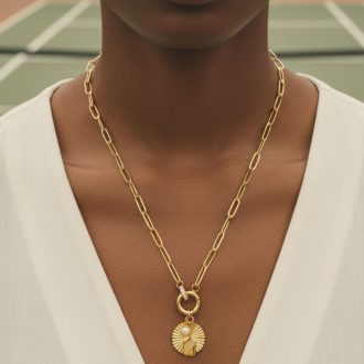 Gold pickleball and padel necklace with caribiner clasp.