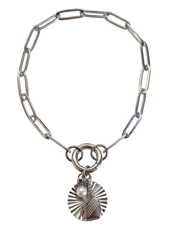 silver pickleball bracelet with round starbust charm Charm holder bracelet with pickleball charm in silver.