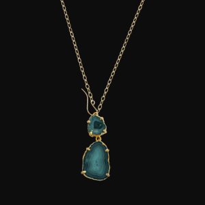 Handcrafted Bora Bora double geode slice pendant necklace on a 14k gold-filled chain featuring a unique front earwire closure.