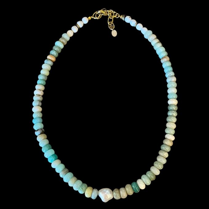 Hand-strung light blue amazonite rondelle necklace with soft white howlite accents, a central irregular white baroque pearl, and a 14k gold-filled clasp with a brass extension chain on a black background.
