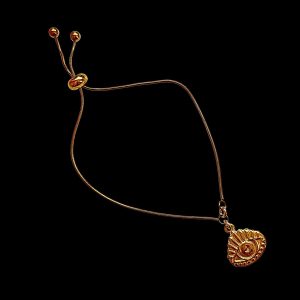 Gold snake chain bolo bracelet featuring a fan-shaped evil eye talisman pendant with ray details, perfect for retail placement in wellness spa jewelry displays.