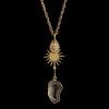 Spa and Resort Jewelry Druzy Quartz and Sunburst Drop Necklace Gold link chain necklace featuring three tiered charms: a teardrop starburst disk, a flat gold sunburst, and and electroplated druzy slice, curated for luxury spa jewelry lines.