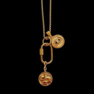 Gold chain necklace featuring a central screw-gate carabiner lock charm holding a textured circular evil eye coin and a hanging snake medallion, designed for edgy resort jewelry lineups.